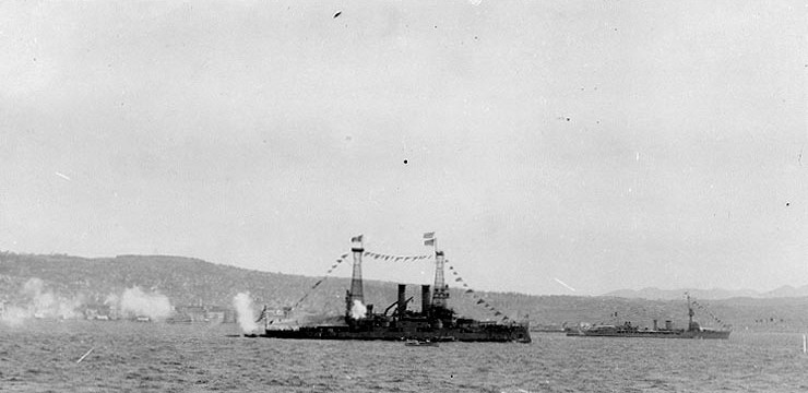 Greek battleship Lemnos firing a salute to US Navy Admiral Mark Bristol at Smyrna, Turkey, 15 Sep 1919; note British D-class light cruiser in background