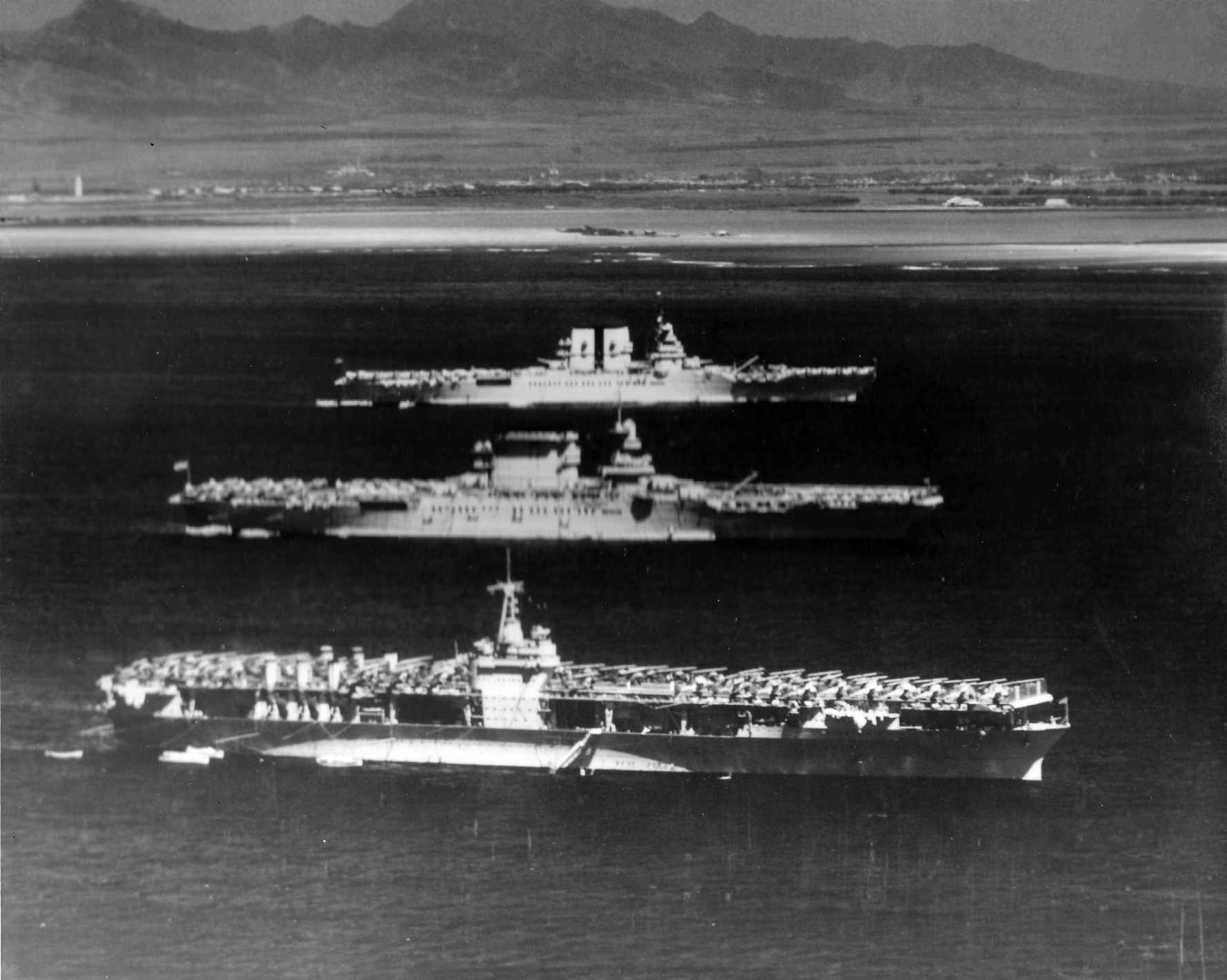 USS Ranger (foreground), USS Lexington (center), and USS Saratoga (background) at anchor off Honolulu, US Territory of Hawaii, 8 Apr 1936