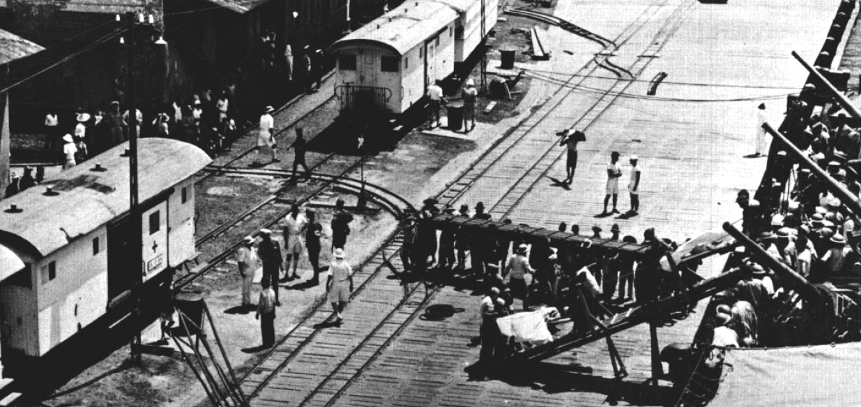 Wounded sailors being taken off of USS Marblehead, Tjilatjap, Java, Dutch East Indies, 4 Feb 1942; seen in Jul 1963 issue of US Navy publication All Hands