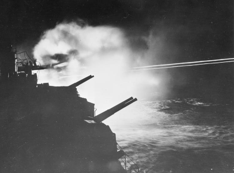 HMS Mauritius firing on German targets in Audierne Bay, France, 23 Aug 1944