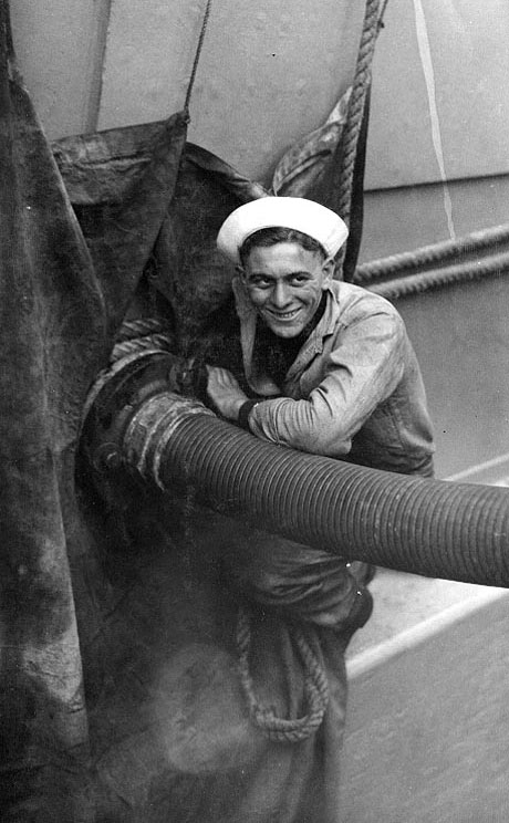 A sailor fueling USS New Mexico, circa 1919