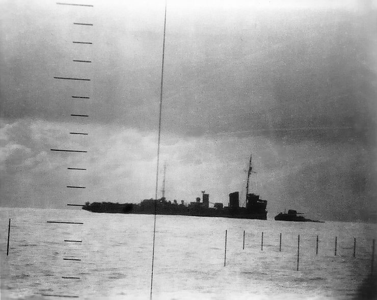 Japanese Patrol Boat #39 sinking after being torpedoed by American submarine Seawolf, 23 Apr 1943; seen from Seawolf's periscope, photo 1 of 2