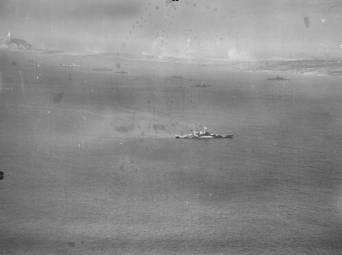 USS North Carolina off Iwo Jima, Japan, 19-22 Feb 1945; note Mount Suribachi on left side of photograph
