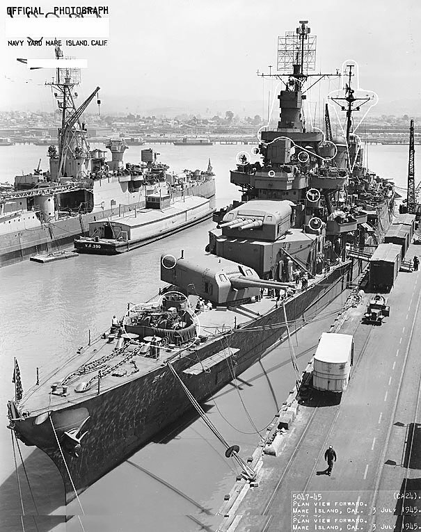 Cruiser Pensacola at end of her final overhaul, with circles marking alterations to the ship, Mare Island Navy Yard, California, United States, 3 Jul 1945; note cruiser Indianapolis and lighter YF-390