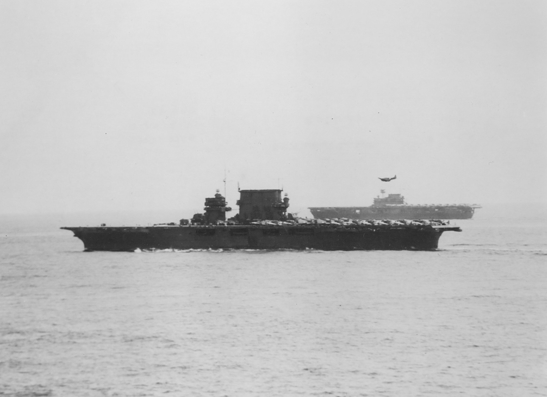 USS Saratoga (foreground) and USS Enterprise (background) underway in the Solomon Islands, Aug 1942