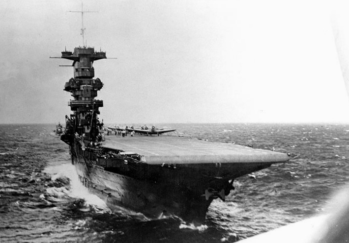 View of USS Saratoga from a TBD-1 Devastator aircraft which had just taken off from the flight deck, circa summer 1941