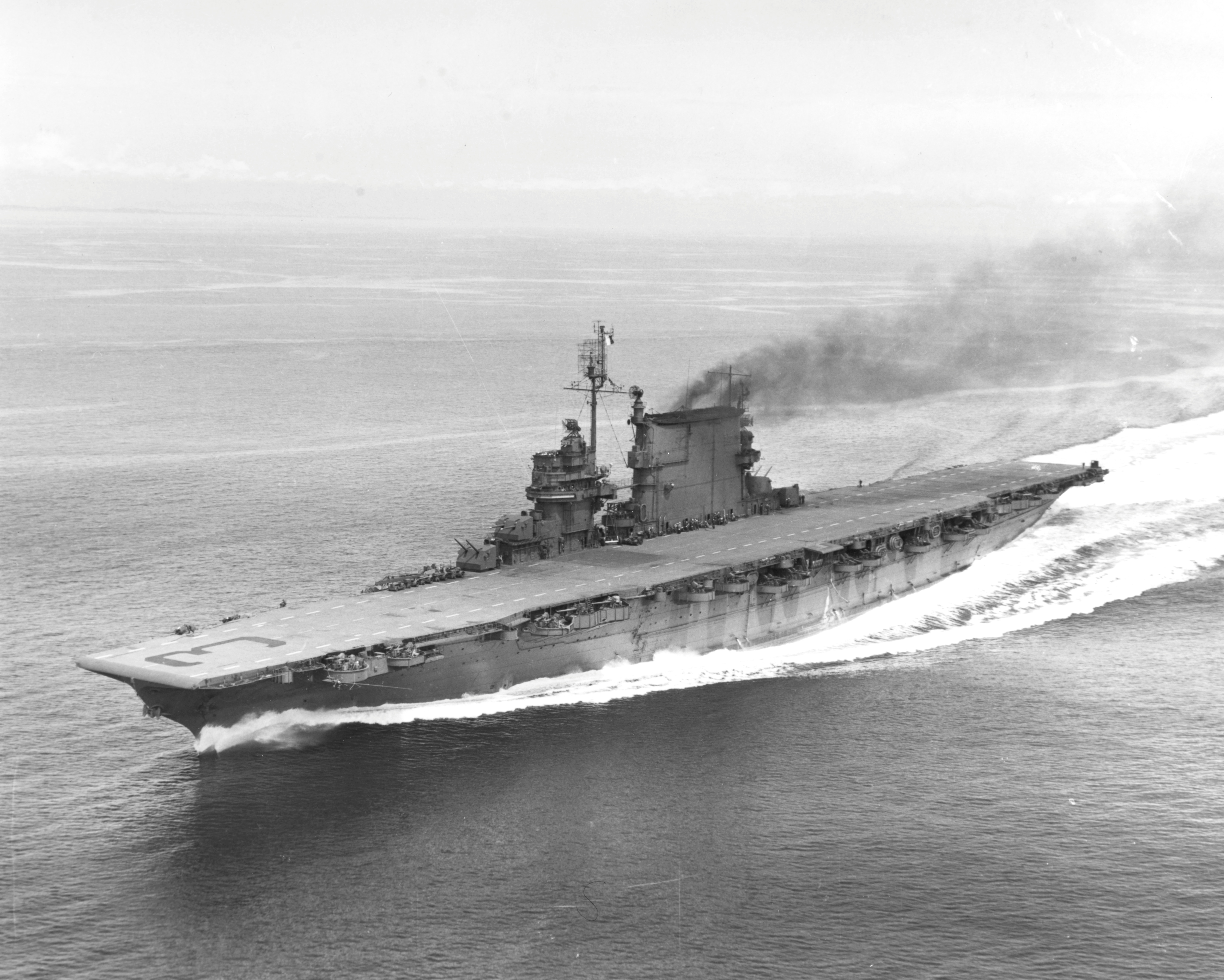 Saratoga running full power trials in Puget Sound, Washington, United States, following battle damage repairs, 15 May 1945. Photo 1 of 2.