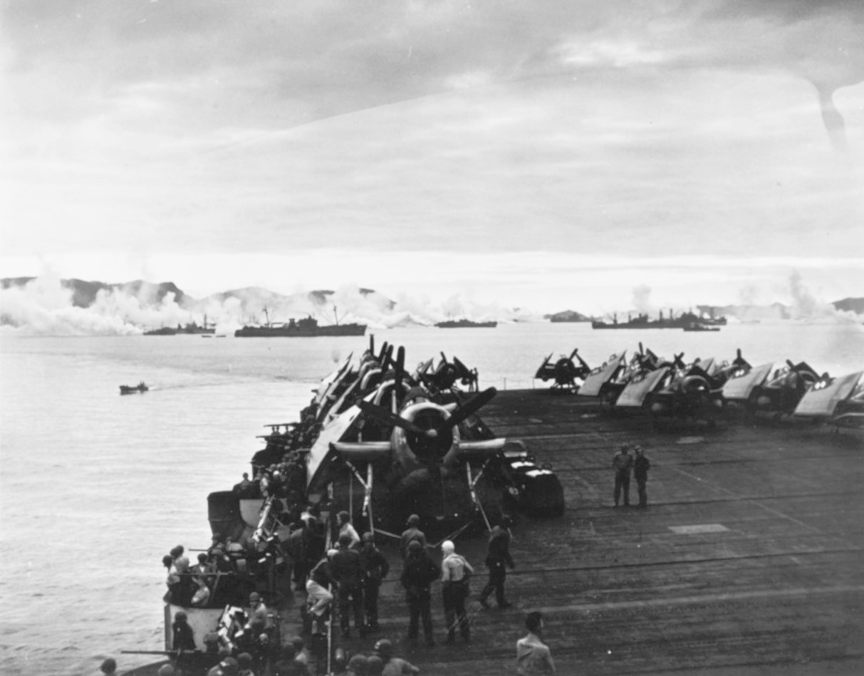 Sargent Bay at Kerama Retto anchorage near Okinawa, Japan, 3 May 1945; USS Sargent Bay with TBM and FM-2 aircraft in foreground