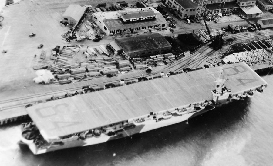 USS Shamrock Bay moored at Astoria, Oregon, United States, 6 Apr 1944; photo taken from aircraft of USS Shipley Bay