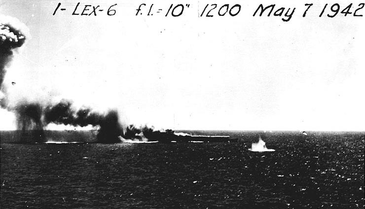 Shoho burning as she was attacked by aircraft, Battle of Coral Sea, 7 May 1942; note TBD-1 Devastator torpedo bomber faintly visible to the right of splash