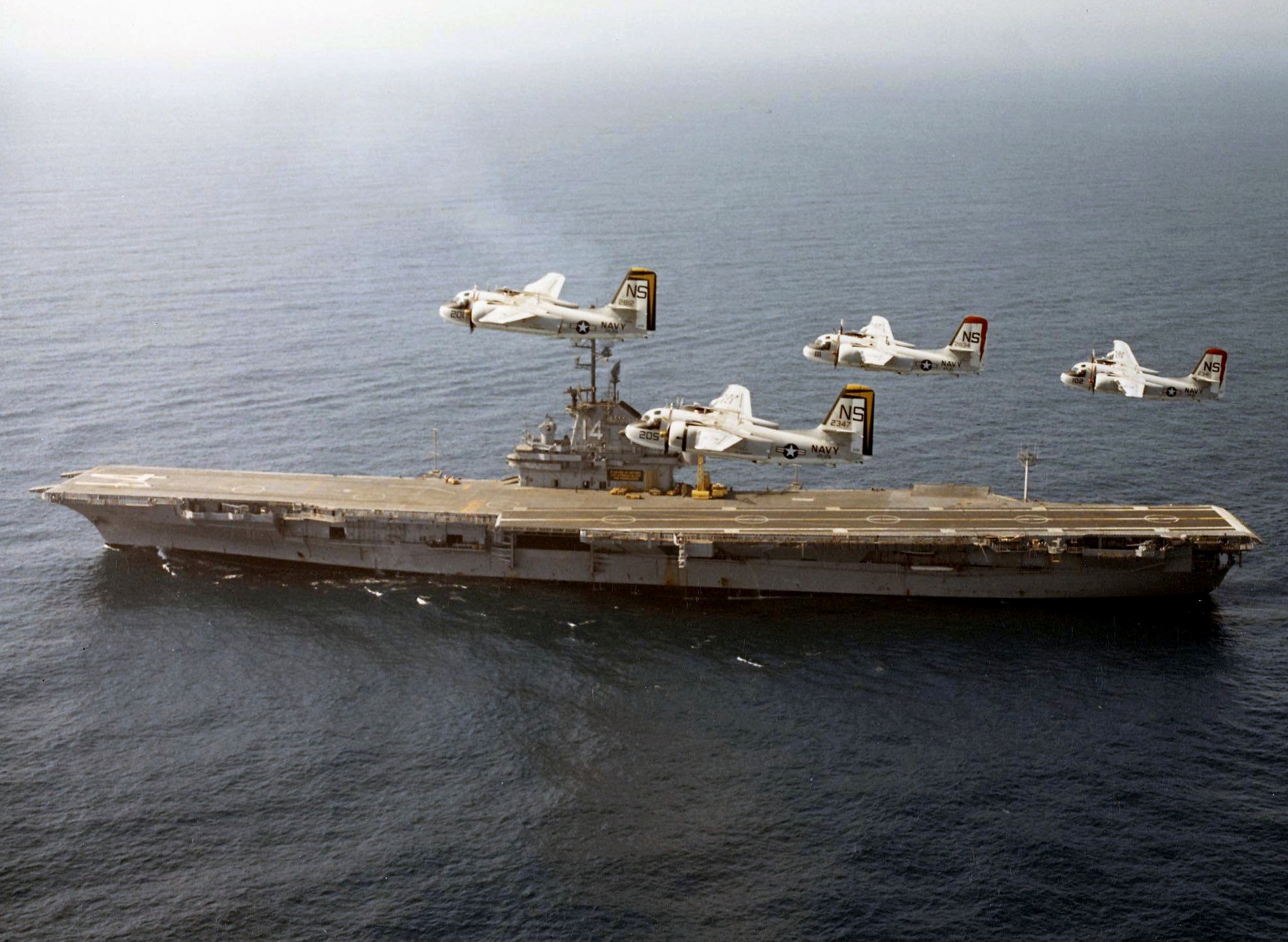 S-2E Tracker aircraft of US Navy squadrons VS-21 and VS-29 in flight over USS Ticonderoga, off San Diego, California, United States, 26 Jun 1970