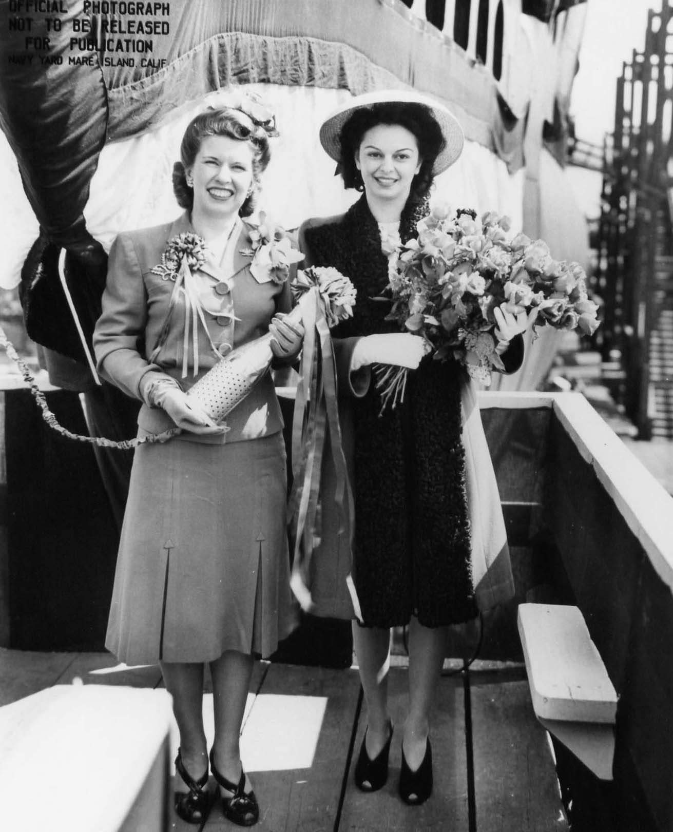 Mrs. Davenport and Mrs. Garvey at the christening of submarine Trepang, Mare Island Naval Shipyard, California, United States, 23 Mar 1944