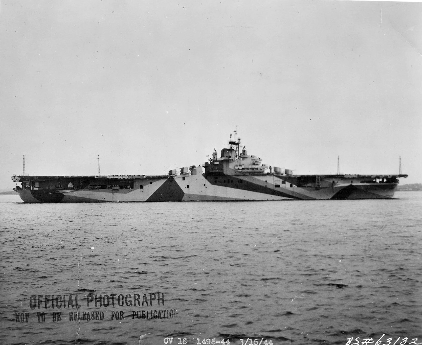 USS Wasp (Essex-class) after her shakedown cruise preparing to leave Boston, Massachusetts, United States, for the Panama Canal, 15 Mar 1944. Note Measure 33/10A camouflage. Photo 1 of 4
