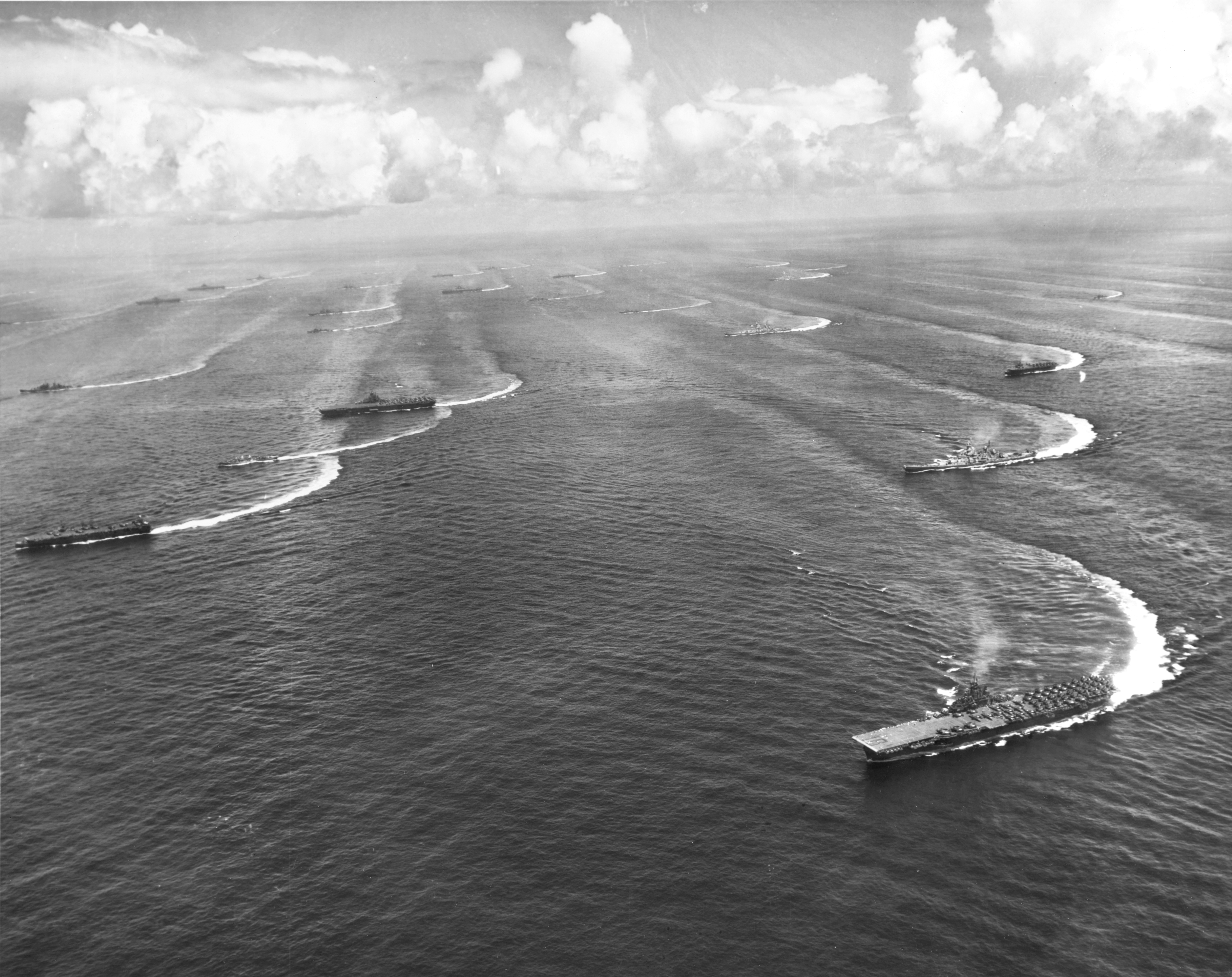 USS Wasp (lower right) and other Essex-class carriers, escorted by battleships, cruisers, and destroyers of Task Force 38 maneuvering off Japan, 17 Aug 1945