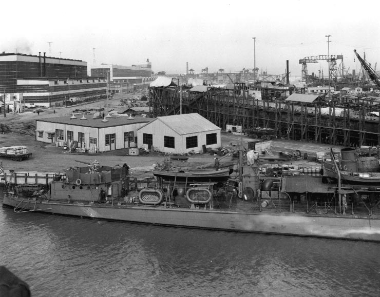 USS Ballard at Mare Island Navy Yard, Vallejo, California, United States, 5 Jan 1942; note submarines under construction, probably Wahoo and Whale