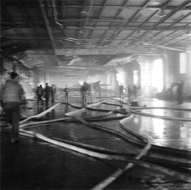 Yorktown's hangar deck just after fire was extinguished, 4 Jun 1942; note the TBD-1 torpedo bomber hanging overhead