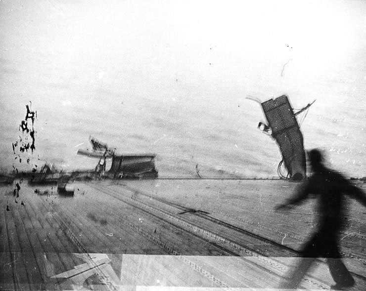 Catwalk on the port side of Yorktown bent as a result of torpedo damage, 4 Jun 1942