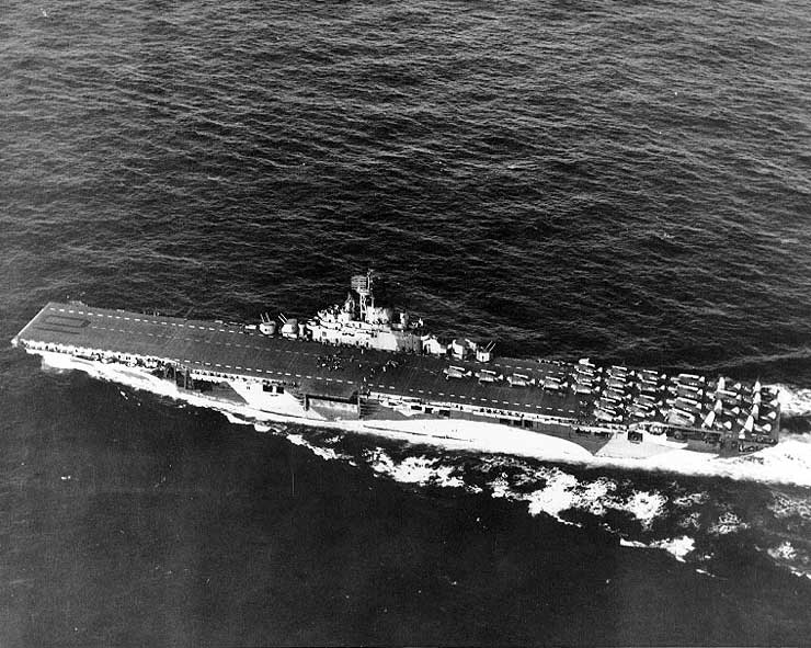 Essex-class carrier Yorktown underway in the Mariana Islands, Jun 1944; note camouflage Measure 33, Design 10a; also F6F Hellcat fighters, TBF Avenger torpedo bombers, and SB2C Helldiver dive bombers