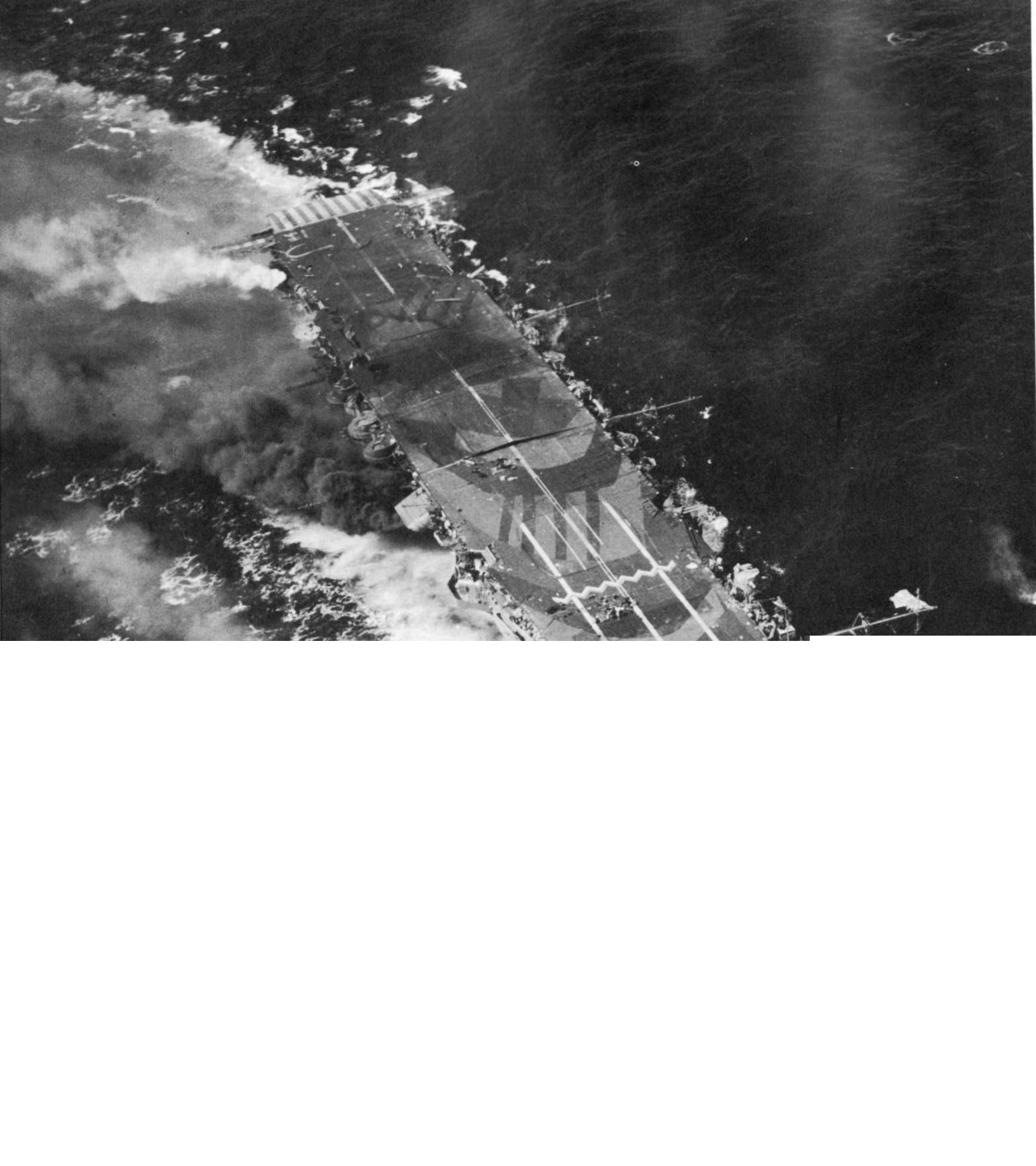 Carrier Zuiho damaged during Battle off Cape Engaño, 25 Oct 1944; note battleship camouflage; as seen on page 68 of US Navy War Photographs