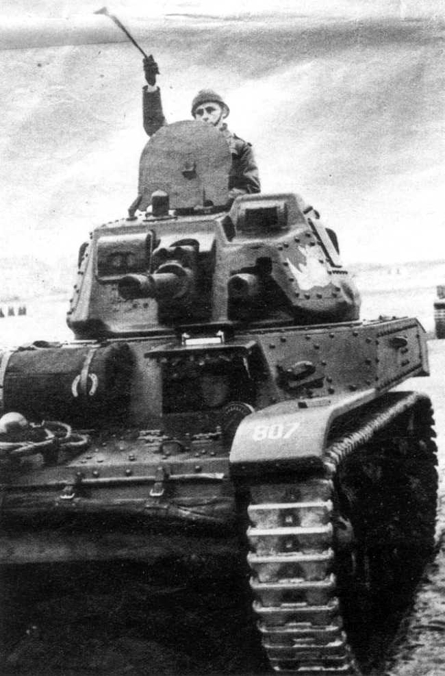 Belgian tank commander signaling from the turret of his A.C.G.1 cavalry tank, Belgium, circa 1938-1940