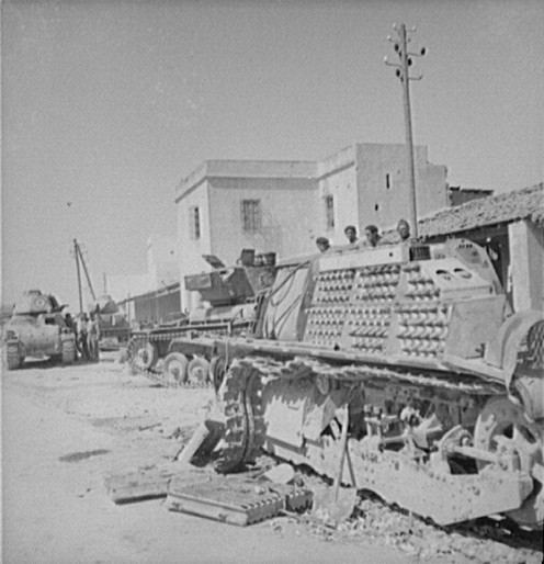 Dismantled French AMC 35 S medium tank, Porto Farina, Tunisia, May 1943; two more AMC 35 S tanks and a Valentine Mk III tank in background
