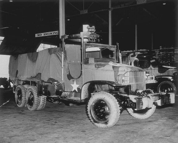 GMC CCKW 2 1/2-ton 6x6 open cab long wheel base transport with gun ring being prepared for shipment to North Africa, Hampton Roads, Virginia, United States, 27 May 1943
