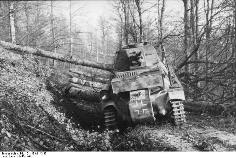 German Panzerkampfwagen 39H 735(f) tank being used to remove trees in a Balkan forest, 1941-1942 photo 1 of 2