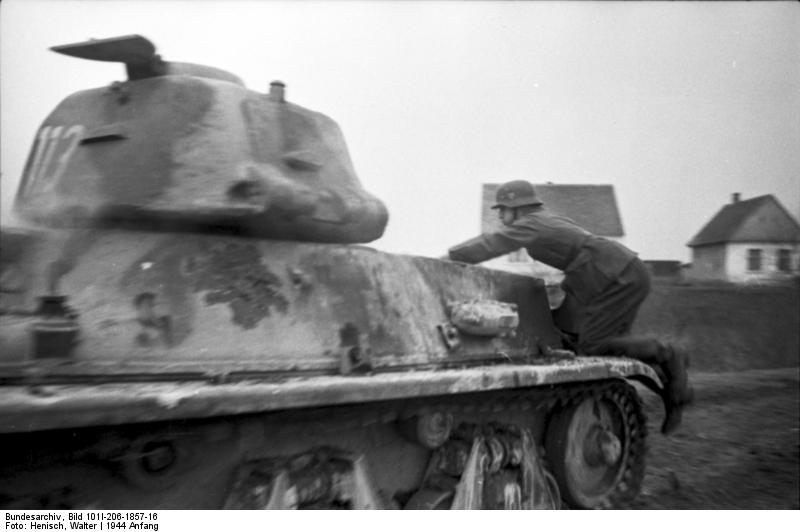 German soldier climbing aboard a captured French H39 tank during an exercise, early 1944