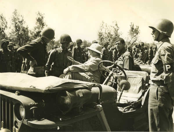 US Secretary of War Henry L. Stimson greeting a Japanese-American US Army captain of 442nd Regimental Combat Team, Route 68, north of Cecina, Italy, 6 Jul 1944