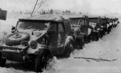 Line of Kübelwagen vehicles parked in the snow, date unknown