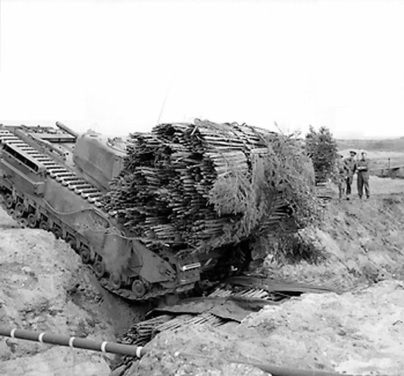 Churchill AVRE vehicle of 163rd Brigade, UK 54th Division, with fascine during ditch crossing exercises near Dunwich, England, United Kingdom, 14 Apr 1943