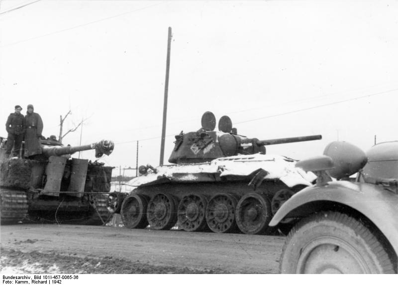 A German Tiger I heavy tank and a damaged Soviet T-34 medium tank, Russia, 1942