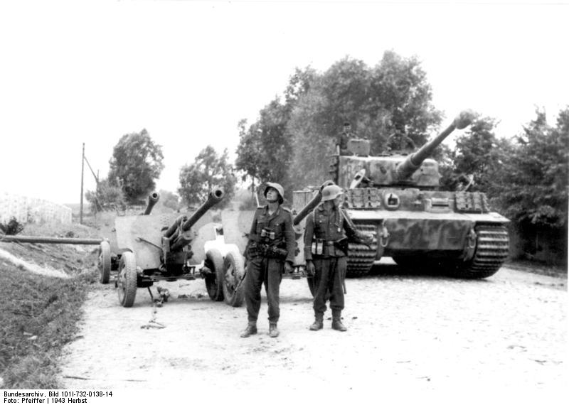 Troops of the German 'Großdeutschland' Division on a road in Russia with Soviet ZiS-3 field guns and a Tiger I heavy tank, fall 1943