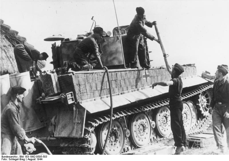 German crew replenishing fuel and ammunition for a Tiger I heavy tank on the Russian Front, Aug 1944, photo 2 of 2