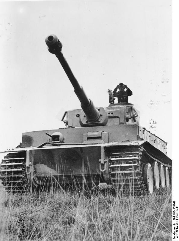 A German tank commander surveying the field atop his Tiger I heavy tank, Russia, Mar 1943