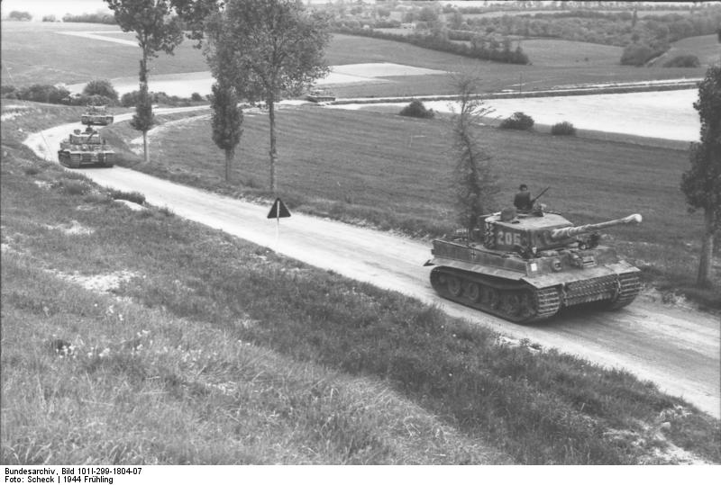 Tiger I heavy tanks of the German 1st SS Division Leibstandarte SS Adolf Hitler on a country road in Northern France, spring 1944, photo 1 of 2