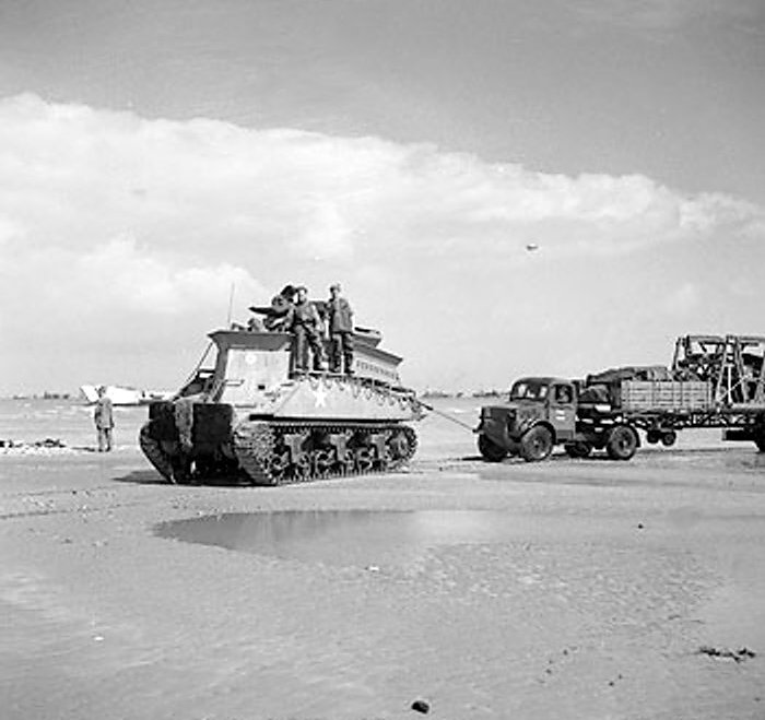 Sherman BARV vehicle towing a disabled Bedford truck, Normandy, France, 14 Jun 1944