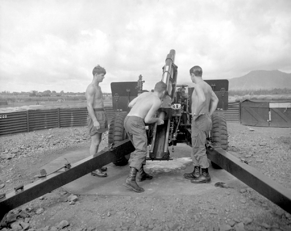 Men of Royal New Zealand Artillery carrying out a fire mission, Vietnam, late 1960s