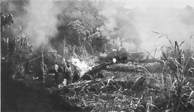 US Marine Corps 105mm Howitzer M2 firing in support of operations at Cape Gloucester, New Britain, Dec 1943