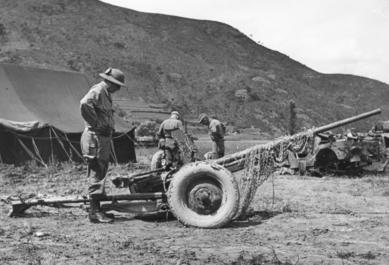 General Frank E. Lowe inspecting a captured Soviet M-42 anti-tank gun near Miryang, Korea, 6 Sep 1950