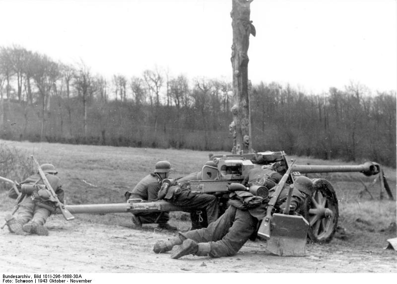 German 7.5 cm PaK 40 gun and crew in Northern France, Oct 1943; note Kar98k rifle