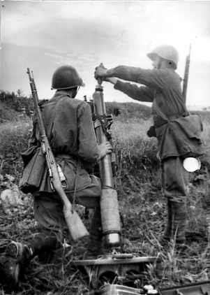 Soviet Kalinin Front gunner I. P.Soropud and loader M. G. Ishimbaev operating a 82-BM-37 mortar, 1942