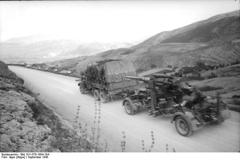 German truck towing an 8.8 cm FlaK gun on a country road near Popoli, Isernia, Italy, Sep 1943