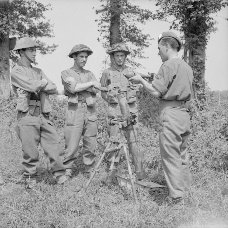Troops of British 59th Division with a captured German 8 cm GrW 34 mortar, Vienne-en-Bessin, France, 1 Aug 1944