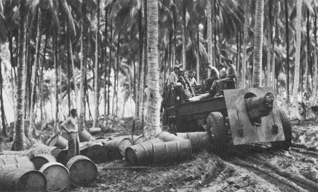 US Marine Corps 155 mm Howitzer Carriage M1917 or M1918 howitzer under tow, Rendova, Solomon Islands, 7 Jul 1943