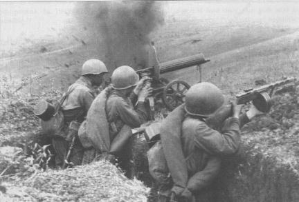 Soviet soldiers in the field with Maxim M1910 heavy machine gun and PPSh-41 submachine gun, date unknown
