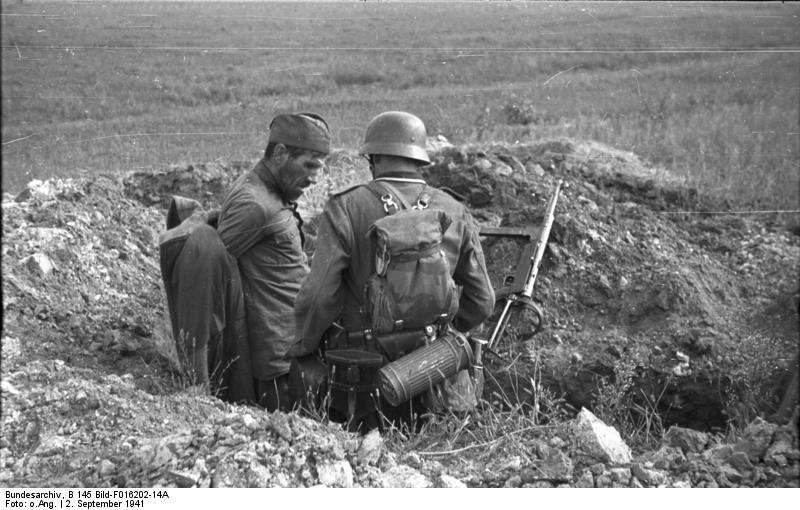 German soldier capturing a Soviet soldier near the Dnieper River in the Soviet Union, 2 Sep 1941; note MP 40 submachine gun