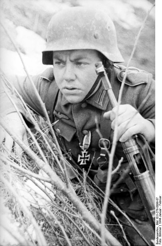 German soldier in the field, Russia, Jan-Feb 1944; note MP 40 submachine gun and Iron Cross 1st Class medal