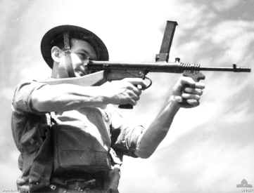 Australian soldier posing with an Owen Machine Carbine, date unknown