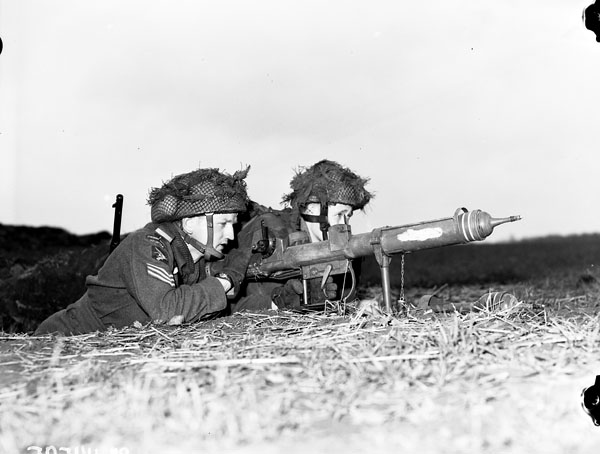 Private L. H. Johnson and Sergeant D. R. Fairborn of 1st Canadian Parachute Battalion with a PIAT launcher, Lembeck, Germany, 29 Mar 1945